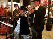 Trumpeters Playing during the lamplighter procession of Victorian Holiday