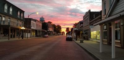Sunrise over the brick street downtown shopping district